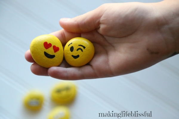 Using emoji painted rocks to teach kids about emotions