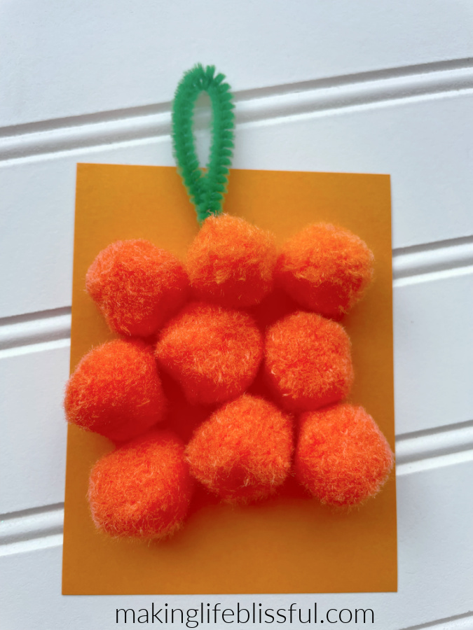 pumpkin-kids-craft-made-with-pom-poms